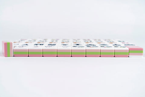 Colorful Mahjong tiles set, featuring pink and green accents, durable acrylic material, perfect for game enthusiasts.