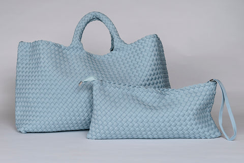 Light blue woven leather tote and pouch set, stylish and versatile for daily use.