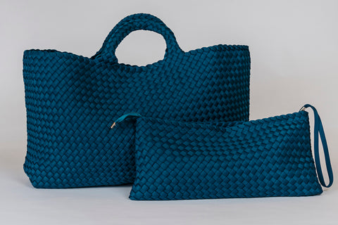 Large teal woven tote bag with matching zip pouch, perfect for stylish storage and everyday use.