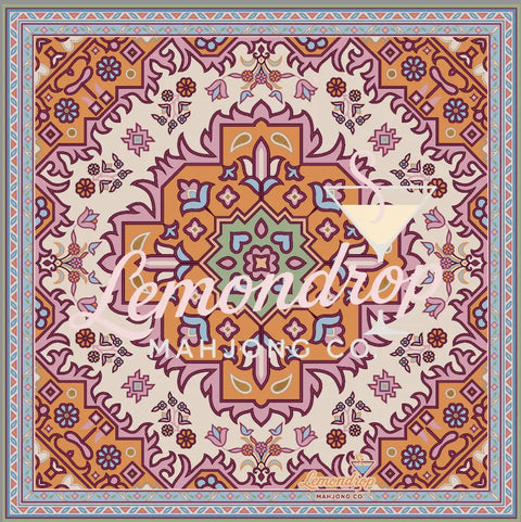 a colorful square pattern on a rug