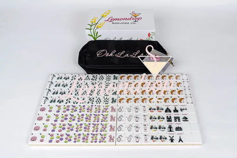 Lemondrop Mahjong set with colorful tiles, black carry bag, and gray pouch, ideal for game enthusiasts.