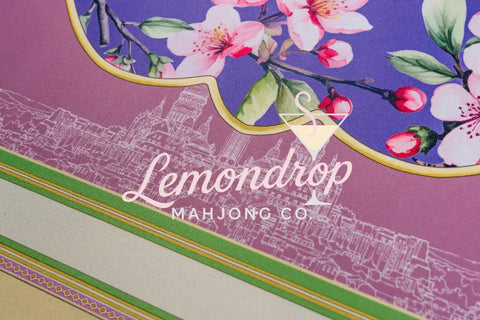 Beautiful floral fabric design with pink blossoms and purple background, perfect for home decor projects.
