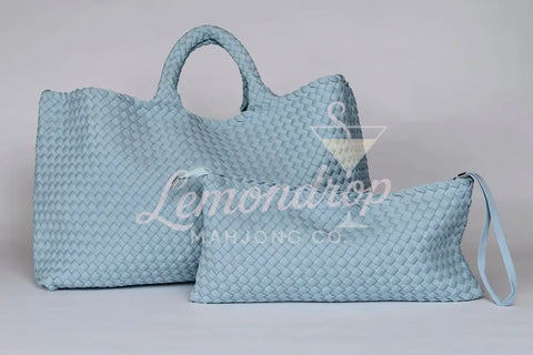 Light blue woven leather tote and pouch set, stylish and versatile for daily use.