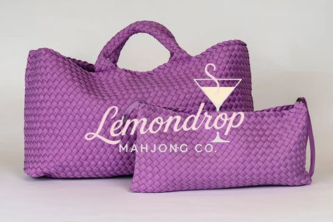 Large and small woven purple bags made of durable material, ideal for stylish storage and travel.