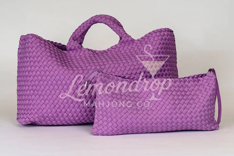 Large and small woven purple bags made of durable material, ideal for stylish storage and travel.