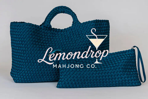 Large teal woven tote bag with matching zip pouch, perfect for stylish storage and everyday use.