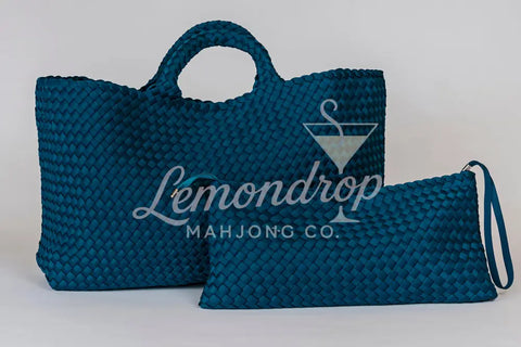 Large teal woven tote bag with matching zip pouch, perfect for stylish storage and everyday use.