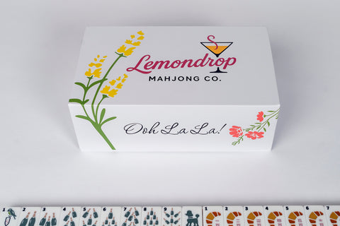 Lemondrop Mahjong Co. game box with floral design, white color, featuring 'Ooh La La!' text.