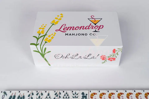 Lemondrop Mahjong Co. decorative box with vibrant floral design, featuring 'Ooh La La!' text.
