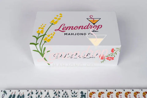 Lemondrop Mahjong Co. decorative box with vibrant floral design, featuring 'Ooh La La!' text.