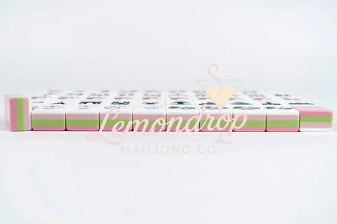 Colorful Mahjong tiles set, featuring pink and green accents, durable acrylic material, perfect for game enthusiasts.
