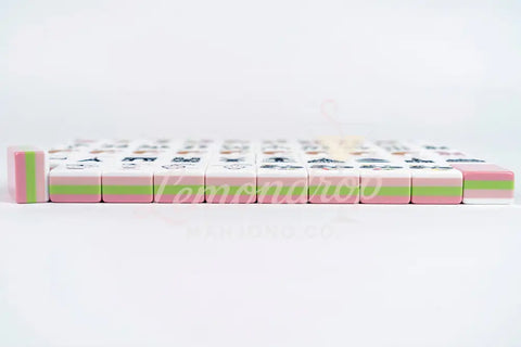 Colorful Mahjong tiles set, featuring pink and green accents, durable acrylic material, perfect for game enthusiasts.