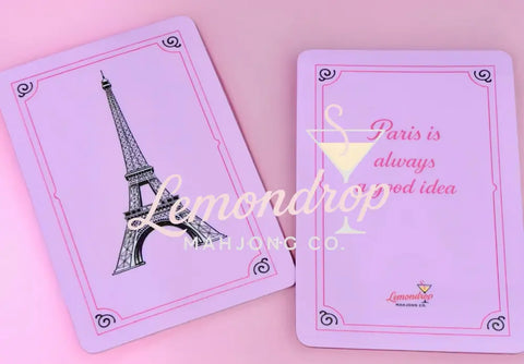 a pink playing cards with a picture of a tower