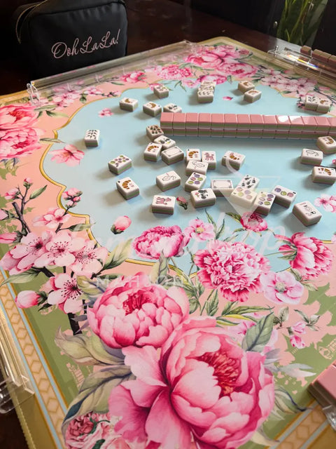 Floral-patterned table with a decorative guitar and dice